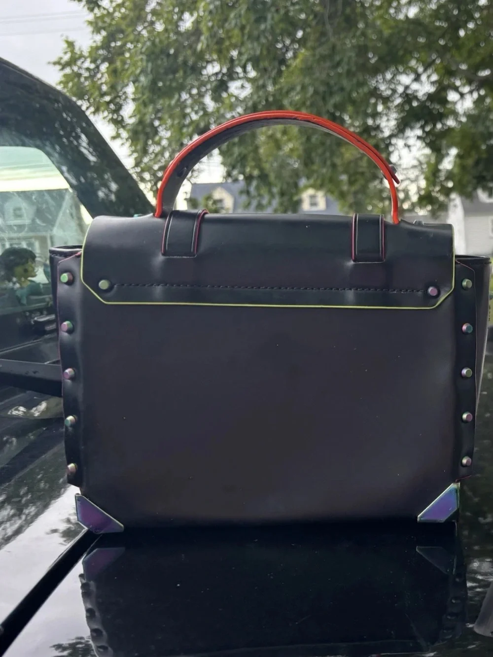 Michael Kors Black Satchel with Iridescent Hardware and Red Trim